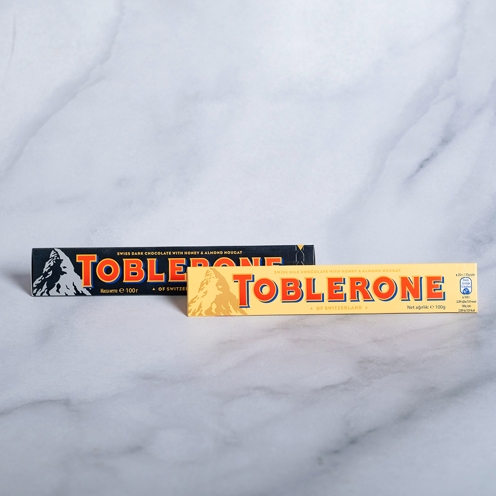 цена Конфеты Toblerone (швейцарский шоколад) 100 г в ассортименте
