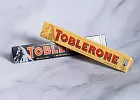 Купить Конфеты Toblerone (швейцарский шоколад) 100 г в ассортименте в  с бесплатной доставкой: цена, фото, описание